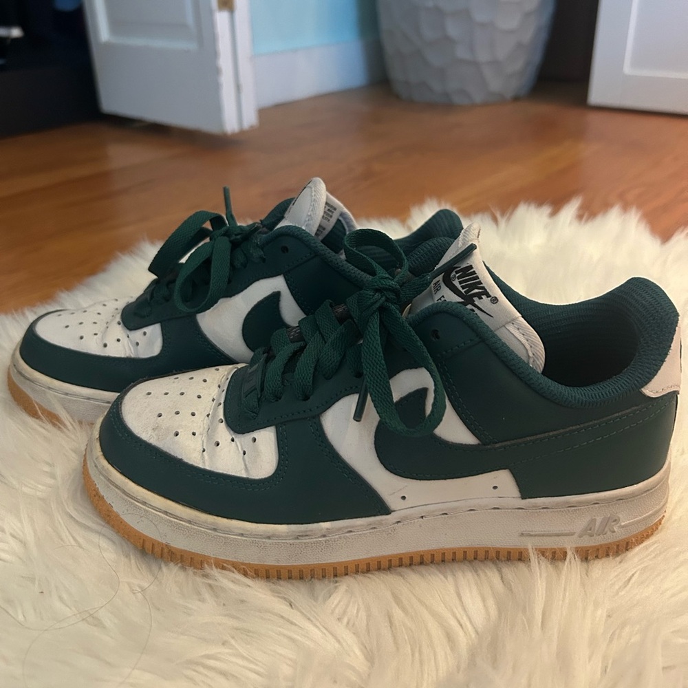 Custom Nike Air Force 1s low white and dark green sneakers with golden soles!